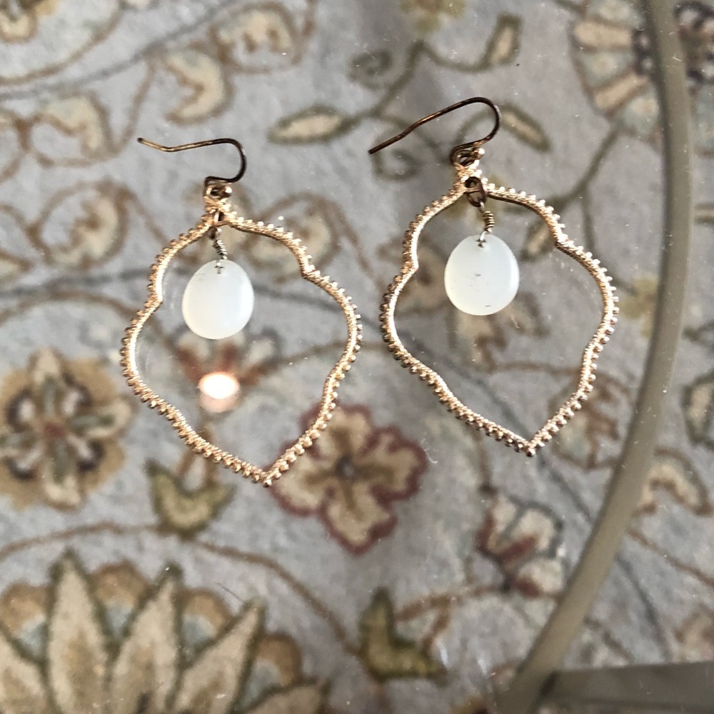 Gold earrings with white stone